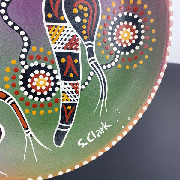 Hand-painted and artist signed Aboriginal terracotta plate