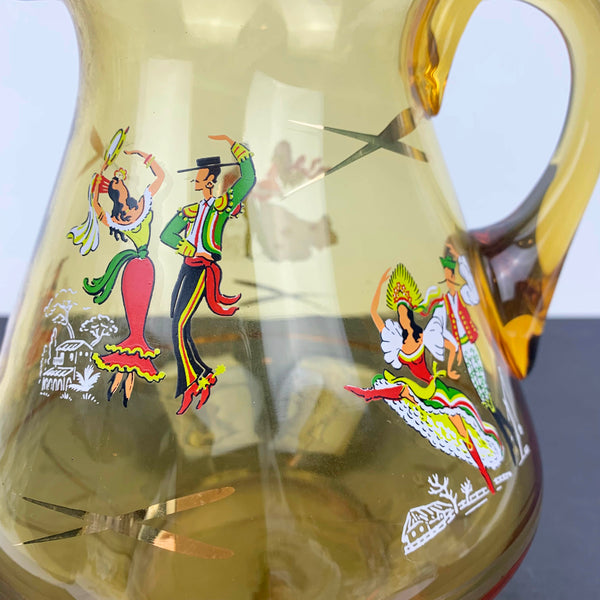 Close up of dancers on mid century amber pitcher