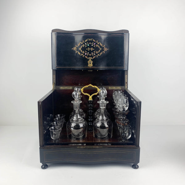 Antique French ebonized wood liquor cabinet with inlaid brass and mother of pearl detail