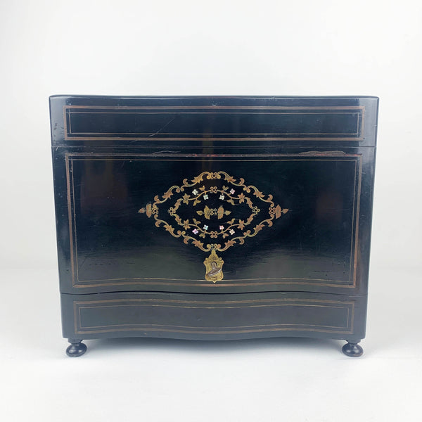 Antique French ebonized wood liquor cabinet with inlaid brass and mother of pearl detail