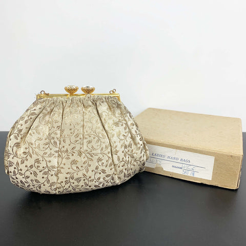 Antique gold brocade evening purse with pleated design and rhinestone closure