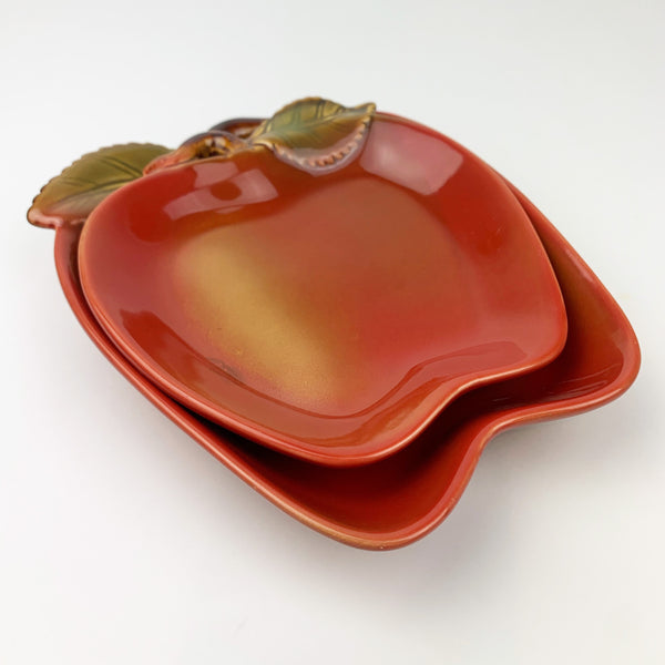 Pair of ceramic apple shape plates stacked together