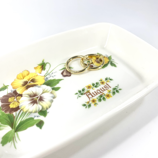 August birth month trinket dish with earrings to indicate size