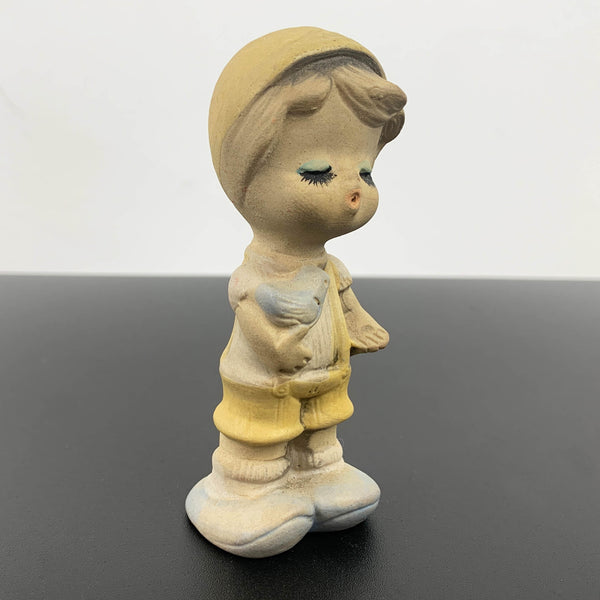 Mid century cute whistling boy with bird figurine