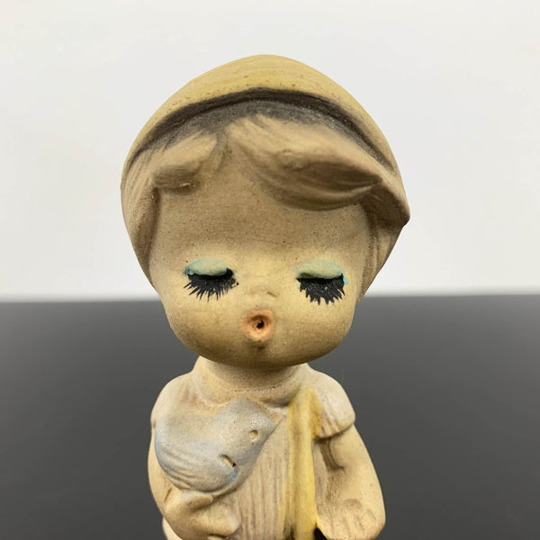 Mid century cute whistling boy with bird figurine