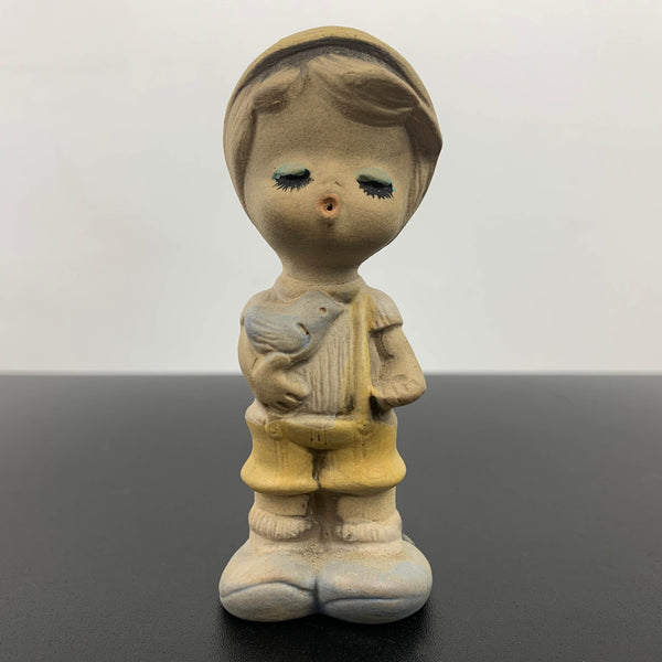 Mid century cute whistling boy with bird figurine