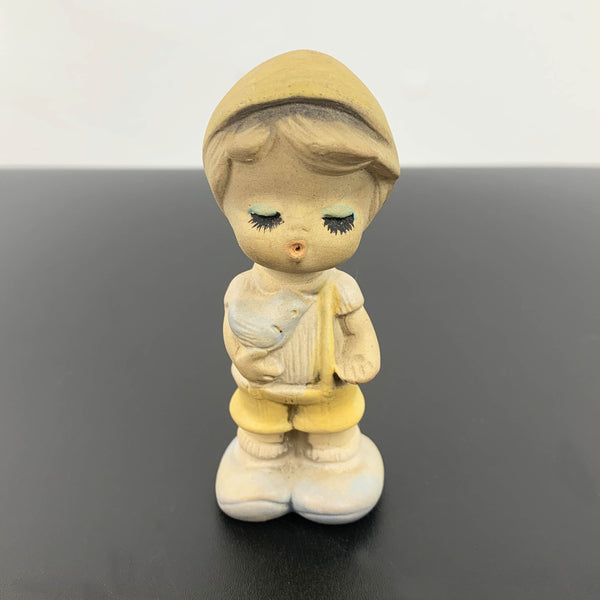 Mid century cute whistling boy with bird figurine