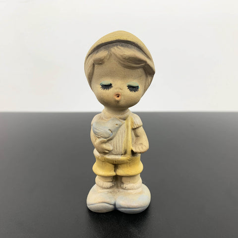 Mid century cute whistling boy with bird figurine