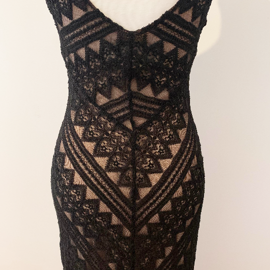 Back of black lace evening dress with nude underlay