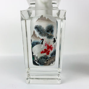 Blue and silver crane art on crystal vase