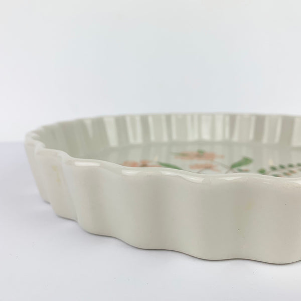 Crimped side of ceramic quiche dish