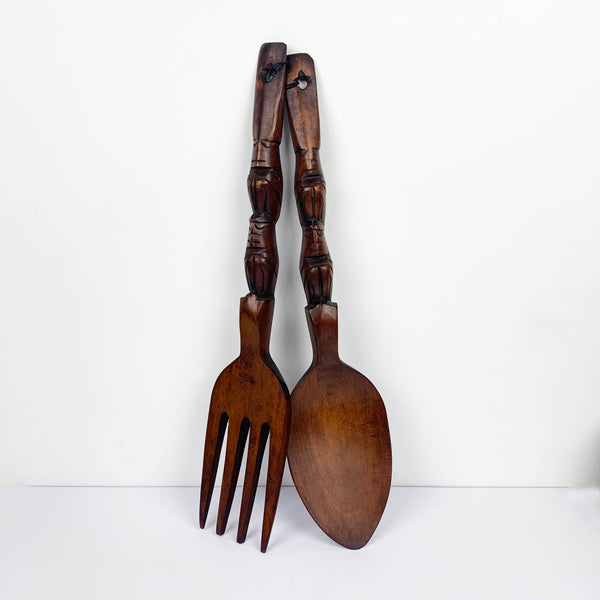 Timber carved cutlery wall hanging