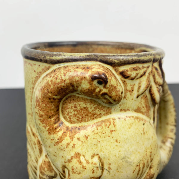 Gempo Pottery Dinosaur Mug with relief moulded dinosaur