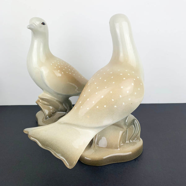 Pair of porcelain love bird figurines showing back view of one bird