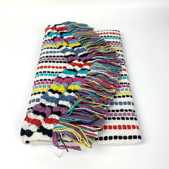 Embroidered cotton multi coloured clutch with tasselled front flap