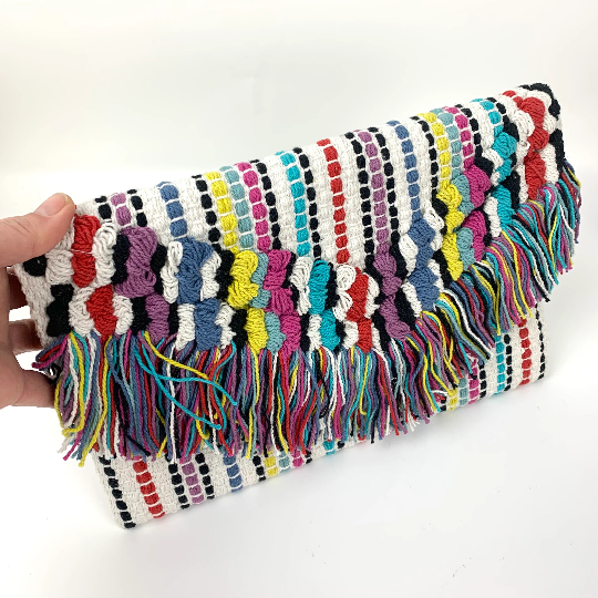 Multi coloured clutch with hand knotted tassel front detail