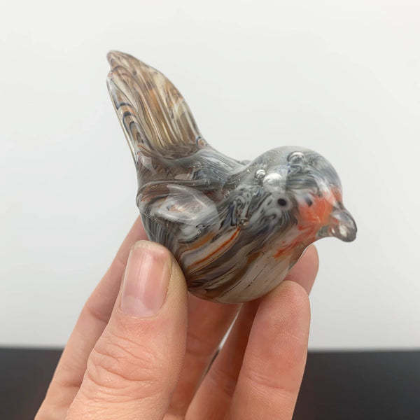 Miniature glass bird ornament with tail detail