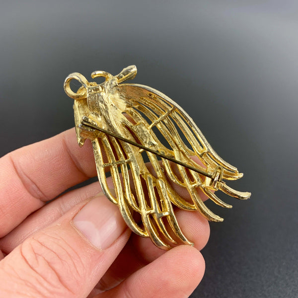 Gold toned feathered leaf style brooch