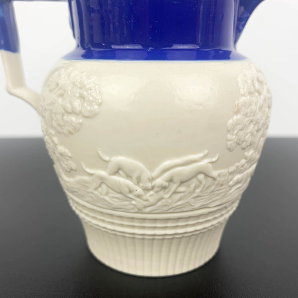 Antique English feldspathic stoneware small jug with fox hunt scene