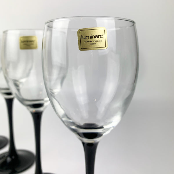 Luminarc black stemmed wine glass with original label