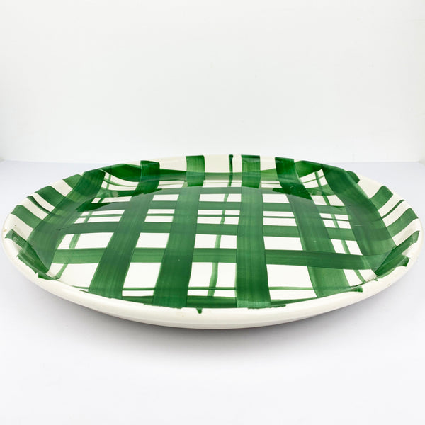 Stoviglierie round platter with green plaid pattern