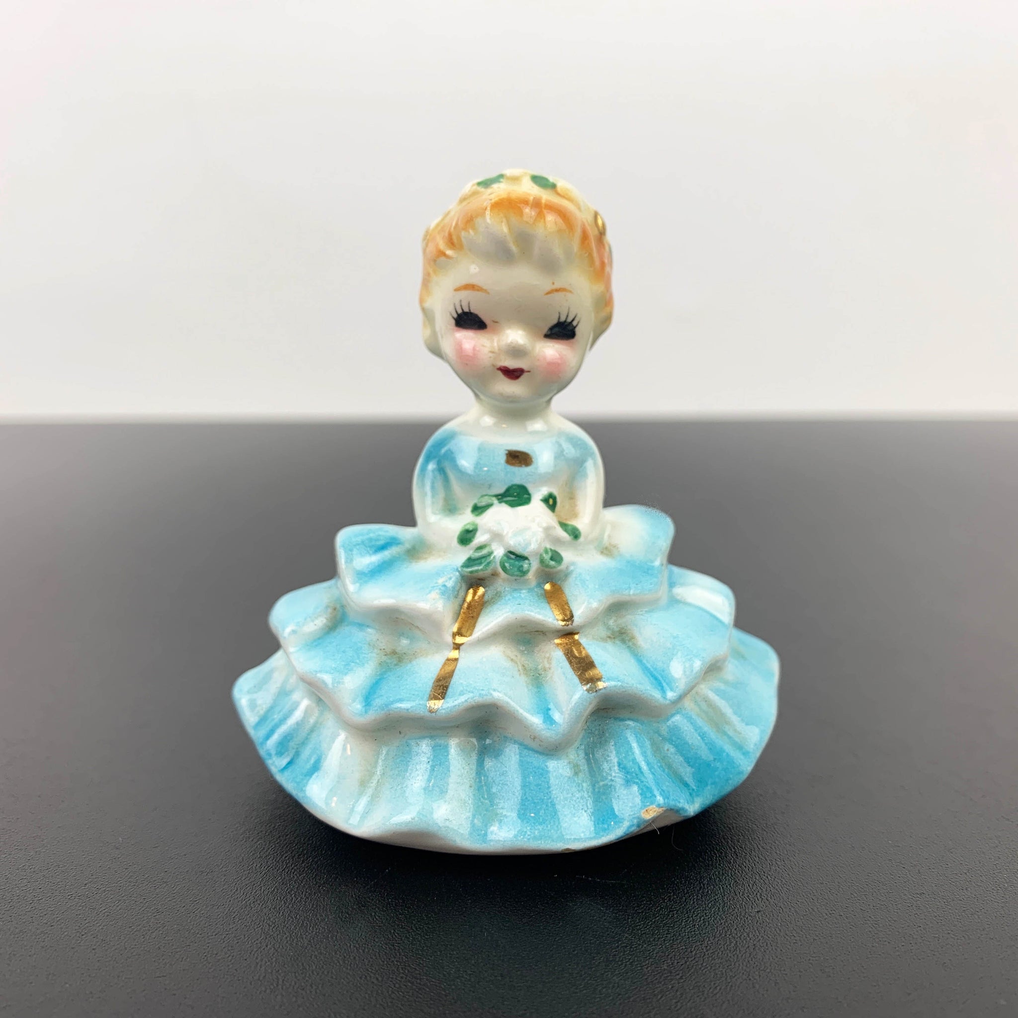 Miniature young girl in ball gown 1950's figurine