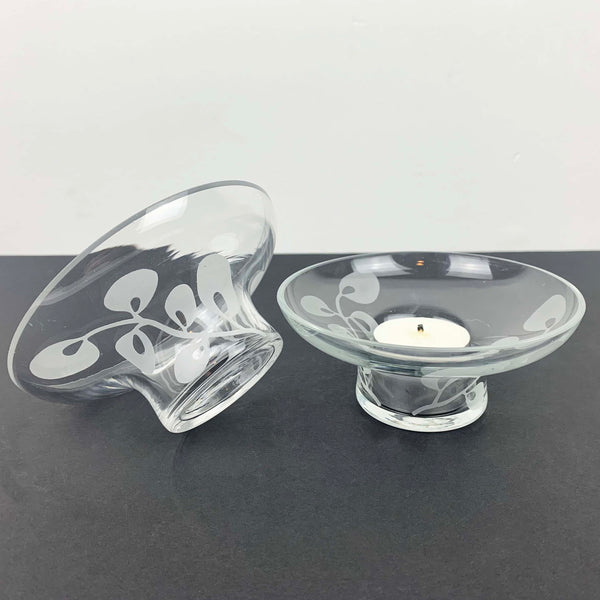 Glass tea light holders with frosted leaf detail with candle displayed