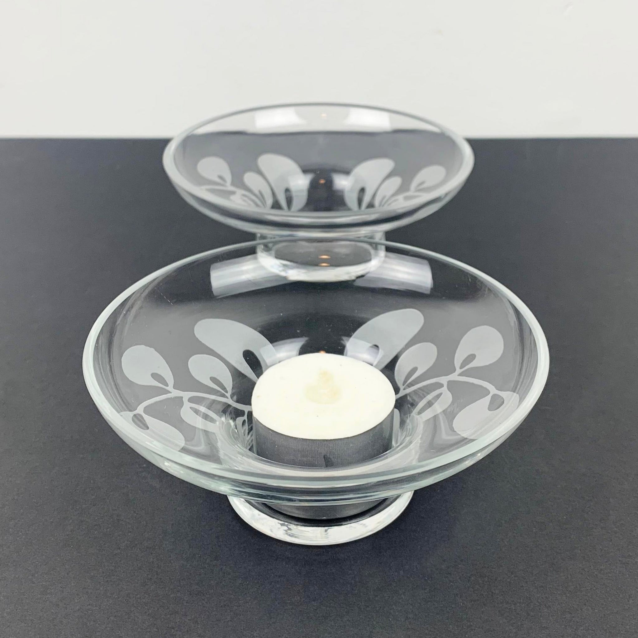 Glass tea light holders with frosted leaf detail 