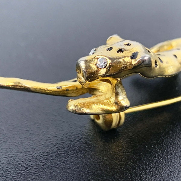 Gold leopard brooch with black enamel spots