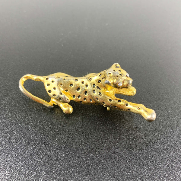 Gold leopard brooch with black enamel spots