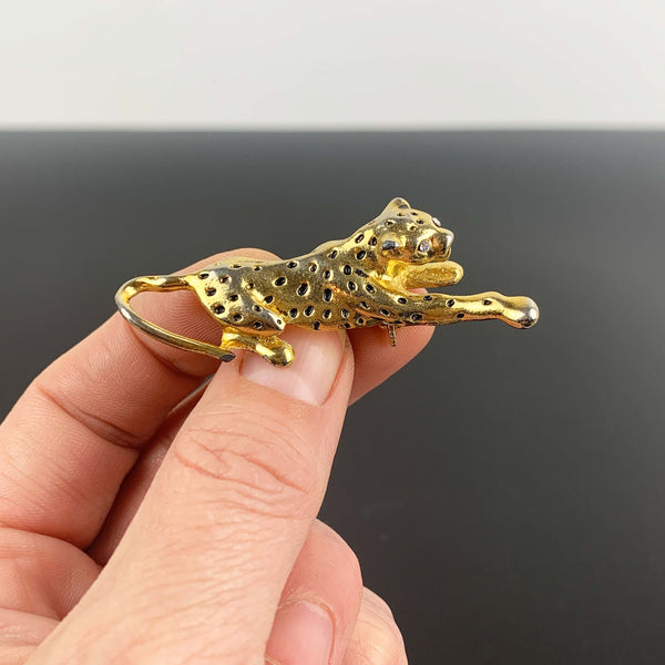 Gold leopard brooch with black enamel spots