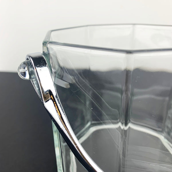 Close up of silver handle on French ice bucket