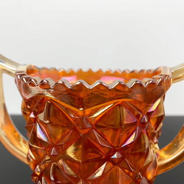 Marigold carnival glass twin handled sugar bowl with sawtooth rim