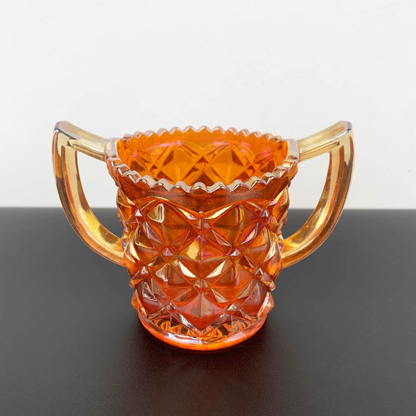 Marigold carnival glass twin handled sugar bowl with sawtooth rim