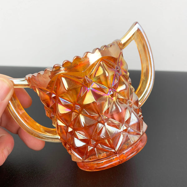 Marigold carnival glass twin handled sugar bowl with sawtooth rim