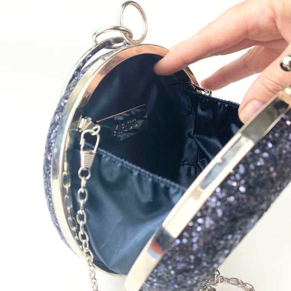 Klass UK round navy glitter clutch