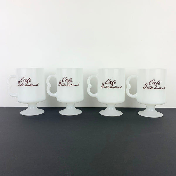 Pyrex USA set of 4 1980's coffee mugs with Cafe International print