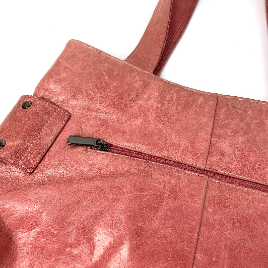 Rear zipper pocket on vintage leather handbag