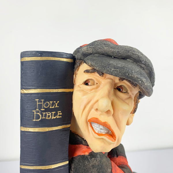 Close up of robber sculpture bookend