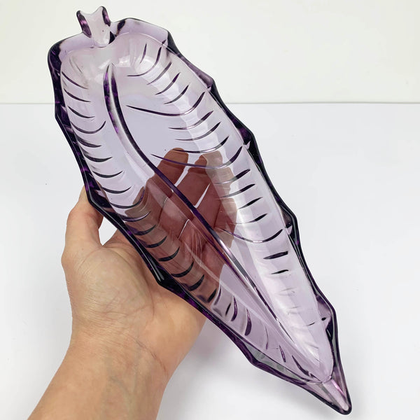 Purple mid century glass leaf shaped dish hand held to indicate size