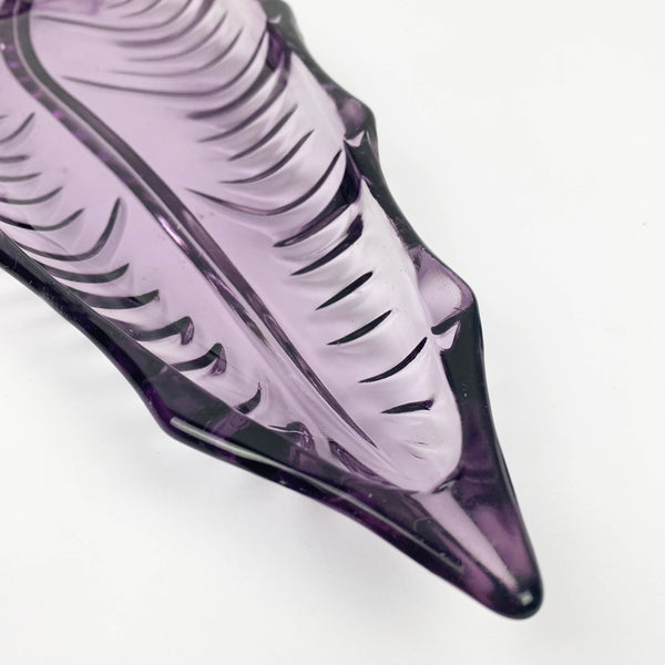 Purple mid century glass leaf shaped dish close up of pointed end