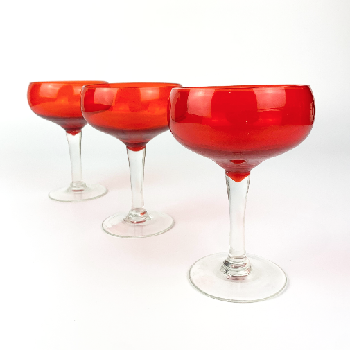 3 bright red champagne glasses