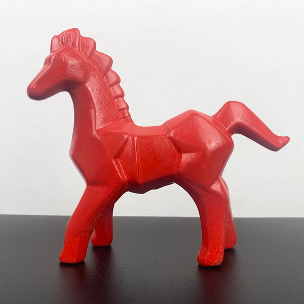 Bright red ceramic horse figurine