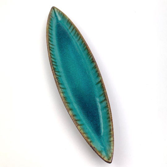 Teal pottery tray with drip glaze