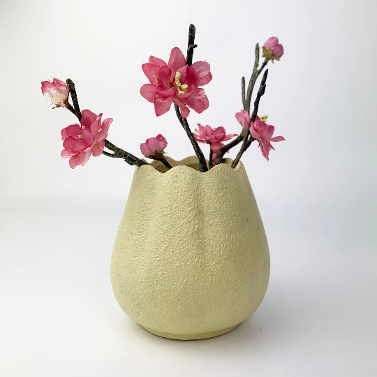 Tulip shape textured pottery vase with floral display