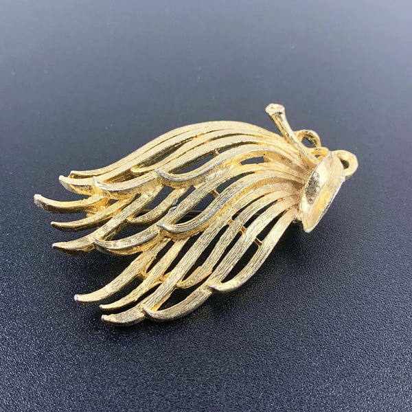 Gold toned feathered leaf style brooch