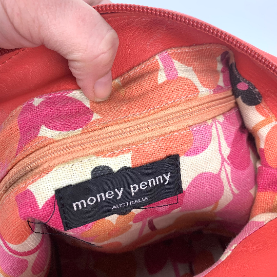 Money Penny label on handbag