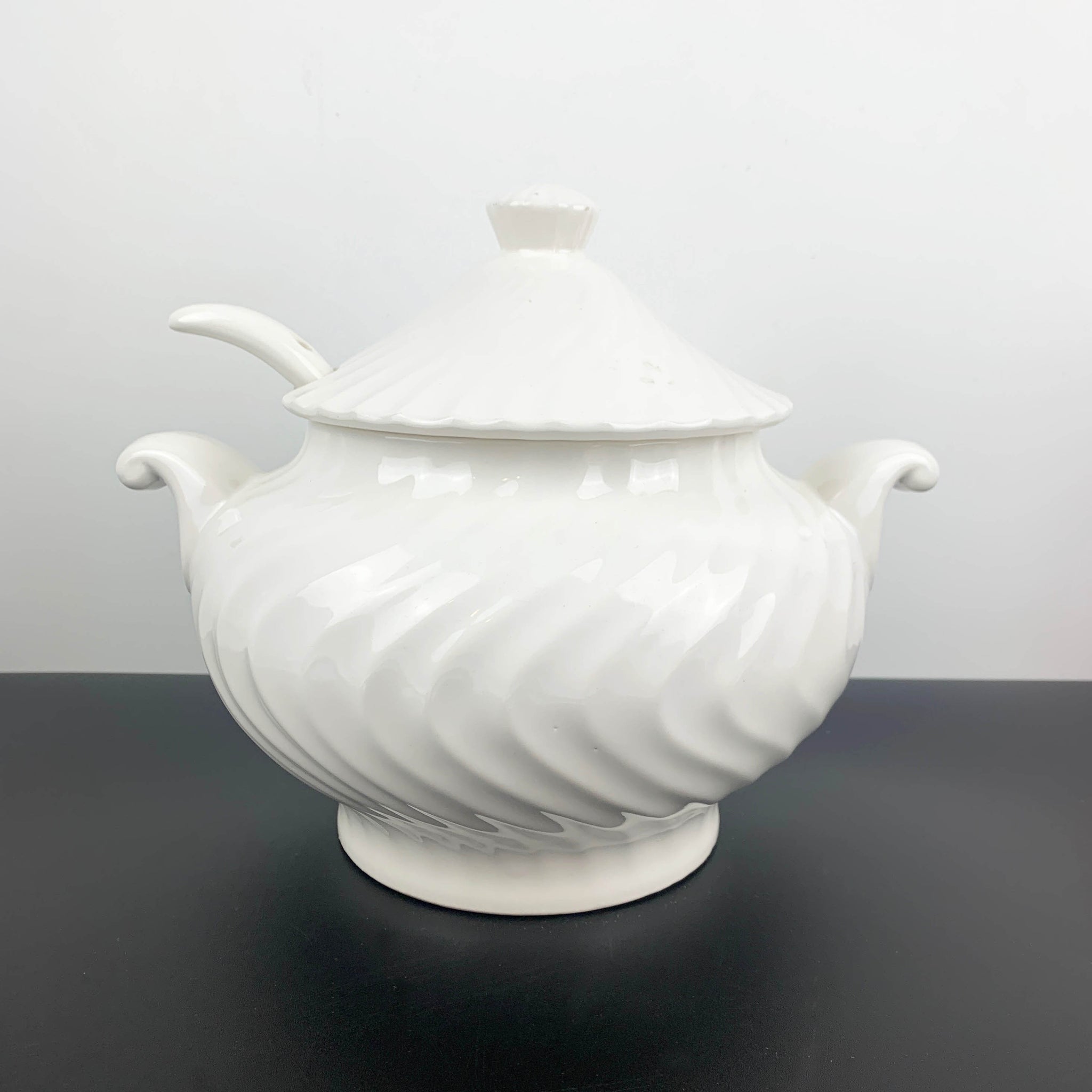 White ceramic ripple patterned soup tureen with lid and ladle