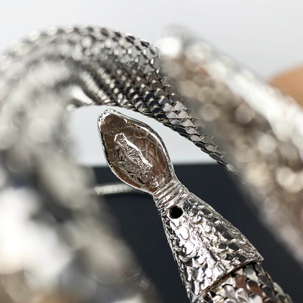 Whiting & Davis logo on silver snake accessories